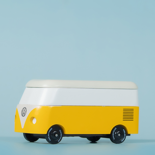 Yellow and white van-shaped cooler on a light blue background