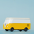Yellow and white van-shaped cooler on a light blue background