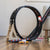 Toy car track set up with a circular track and small cars on a wooden floor.