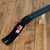 Toy car on a black track on a wooden floor