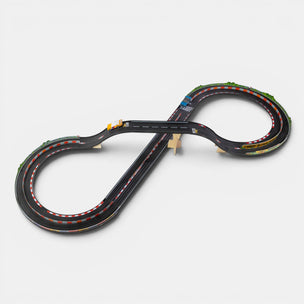 Model of a slot car racing track on a white background