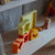 Colorful wooden blocks and toy train on a shelf