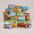 Stack of toy car boxes with various models on a light background