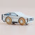 Wooden toy car with a white body and wooden wheels on a beige background