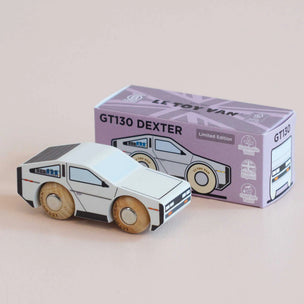 Wooden toy car GT130 Dexter in front of its packaging box on a beige background