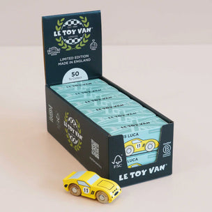 Display box of Le Toy Van toy cars with a yellow car in front