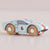 Wooden toy car with a light blue body, red and black accents, and the number 6 on a beige background.