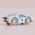 Toy car with wooden wheels on a beige background