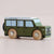 Green toy van with wooden wheels on a beige background