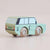 Wooden toy car with a retro design on a beige background