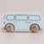 A wooden toy bus with a light blue body and natural wood wheels, shown from a side profile against a solid light beige background.