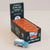 A display box of Le Toy Van limited edition wooden toy cars, with a small blue and white wooden van placed in front on a light beige background.