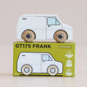 A wooden toy van labeled 'GT175 FRANK' sits on top of its matching green packaging box. The van has a white body with light blue window details and natural wood wheels.