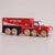 Red toy truck with wooden wheels from Le Toy Van on a beige background
