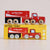 Red toy truck on top of its packaging box with 'Le Toy Van' branding.
