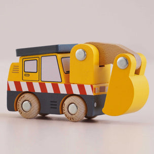 Wooden toy truck with a yellow body and gray roof on a light background