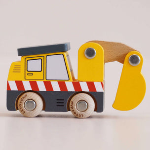 Wooden toy excavator with a yellow scoop on a light background
