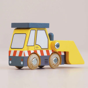 Wooden toy bulldozer with a yellow body, blue roof, and brown wheels on a light beige background.