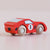 Red toy car with the number 8 on a light pink background