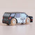 A wooden toy police car with a black and white painted body, realistic wood-grain wheels, and printed 'POLICE' and 'LET TOY VIAN' text, shown on a plain beige background.