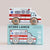 A wooden toy ambulance with a white body, red stripes, and light wood wheels sits on top of its light blue retail box. The box features the text 'GT265 LANCE' and 'Limited Edition' along with an illustration matching the toy.