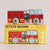 A red and white wooden toy fire truck with light blue windows sits on top of its yellow retail box. The box features the text 'GT270 QUINN' and 'Limited Edition' along with an illustration of the fire truck.
