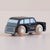 Toy taxi model on a plain background