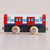 a toy train facing sideways with a plain background 