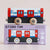 Toy train model with a matching box on a light beige background
