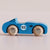 Blue toy car with wooden wheels on a beige background