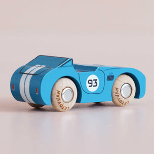 Blue toy car with white stripes and number 93 on a beige background