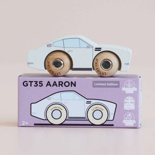 A wooden toy car labeled 'Limited Edition' displayed on top of its lavender packaging box, which is labeled 'GT35 AARON Limited Edition'.