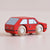 Red toy car with wooden wheels on a beige background