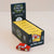 A display box of Le Toy Van limited edition toy cars, with a small red wooden car in front on a light beige background.