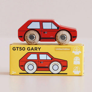 Wooden toy car on top of its packaging box with 'GT50 GARY' branding.