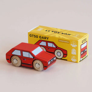 A red wooden toy car with natural wood wheels, shown in front of its yellow packaging box labeled 'LL TOY VAN GT50 GARY'.