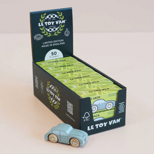 Le Toy Van toy car packaging with a single toy car in front on a light background