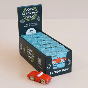 Le Toy Van packaging with a red toy car in front on a beige background