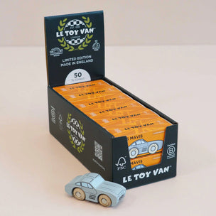 Le Toy Van packaging with a toy car in front on a beige background