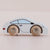 A side-view wooden toy car with a white body, light blue window, and natural wood wheels engraved with the brand name 'LET'S PLAY'.
