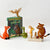 Toy figures of characters from 'The Gruffalo' book on a white background