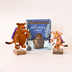 The Gruffalo's Child book with two plush toys on a white background