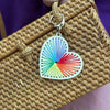 Colorful heart-shaped keychain on a woven bag