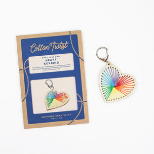 Heart-shaped keyring with rainbow pattern on a Cotton Twist packaging