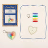 Cotton Twist keyring craft kit with colorful heart-shaped keychain and packaging on a white background
