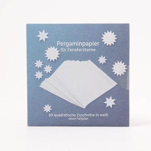 Pack of pre-cut white kite paper or window stars