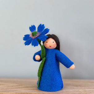 Little felt Cornflower flower fairy doll with blue dress and holding a felt cornflower | © Conscious Craft 