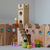 Wooden building blocks with colorful spheres on a gray background