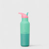 Green water bottle with pink lid on a light gray background