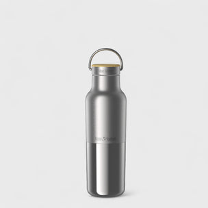Silver water bottle with a gold cap on a light gray background